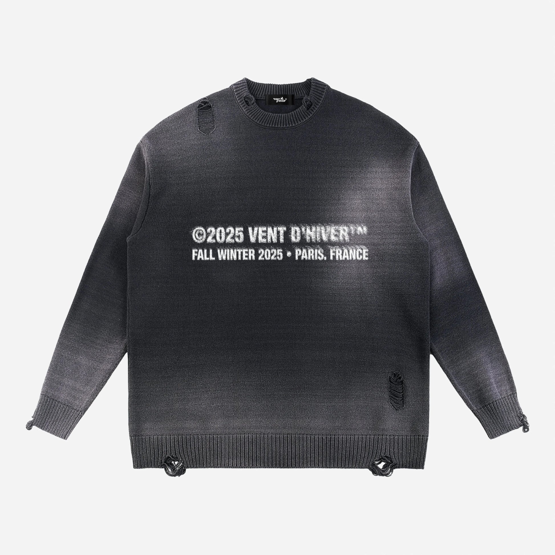 Black sweater with white text on a light gray background